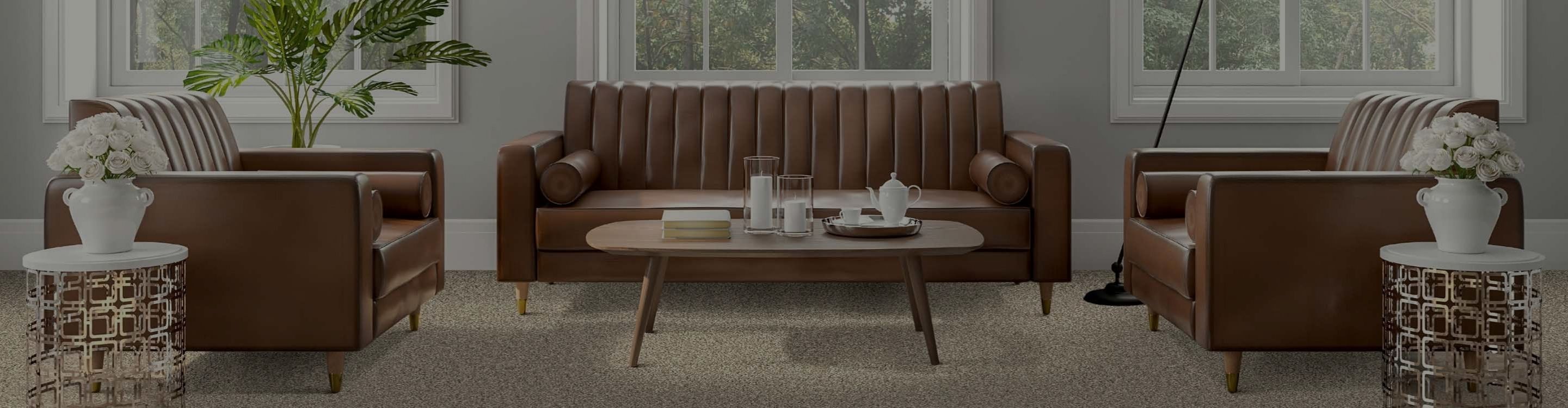beige carpet in modern living room with leather furniture, potted plants and coffee table